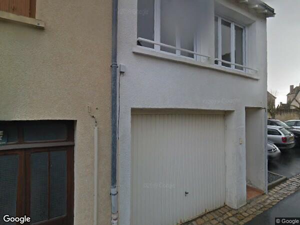 UN IMMEUBLE À USAGE DE GARAGE