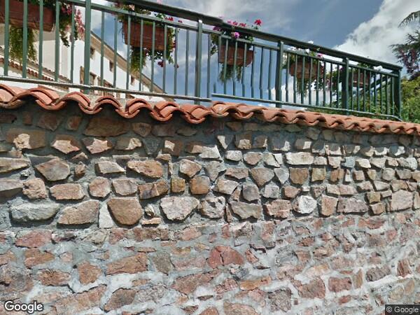 UN  BÂTIMENT A USAGE DE DÉPÔT