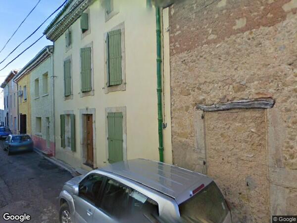 UN IMMEUBLE D'HABITATION ET COMMERCIAL