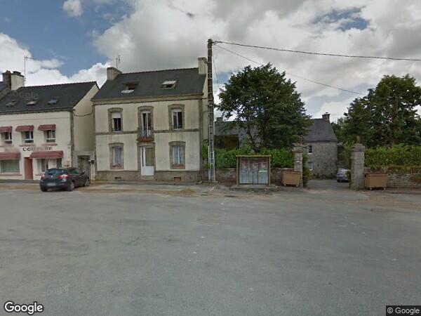 UN  IMMEUBLE À USAGE DE COMMERCE ET D’HABITATION (T2)