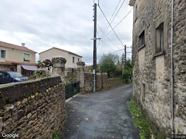 UNE MAISON À USAGE D'HABITATION  AVEC GARAGE ET TERRAIN ATTENANT