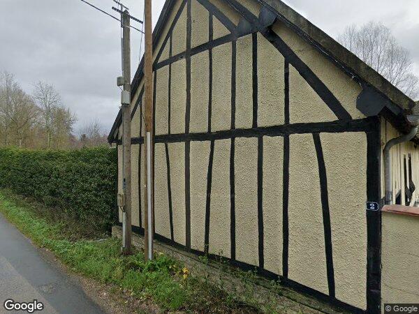 UNE MAISON D'HABITATION ET DES PARCELLES DE TERRAIN