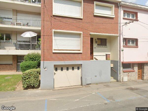 UN APPARTEMENT DE TYPE F2 AVEC UNE CAVE ET UN GARAGE