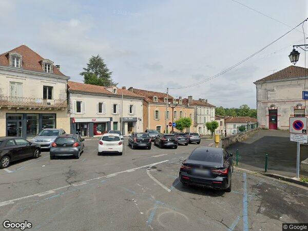 UN IMMEUBLE À USAGE D’HABITATION ET DE COMMERCE