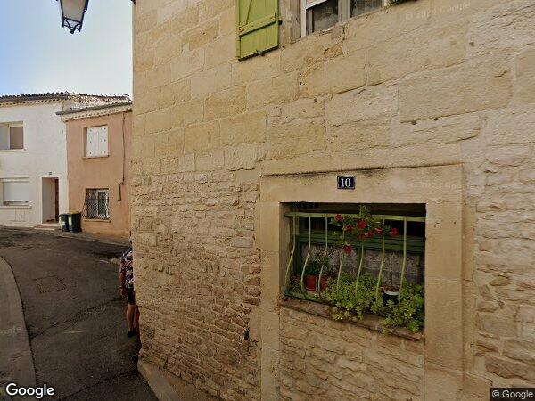 UN APPARTEMENT AVEC DEUX PLACES DE PARKING COUVERT