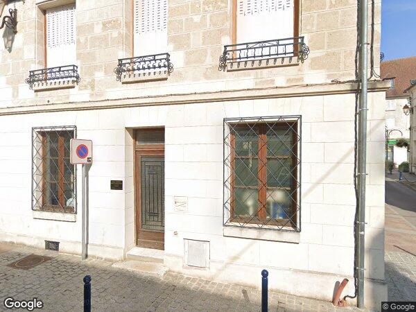 UN IMMEUBLE À USAGE DE COMMERCE ET D’HABITATION