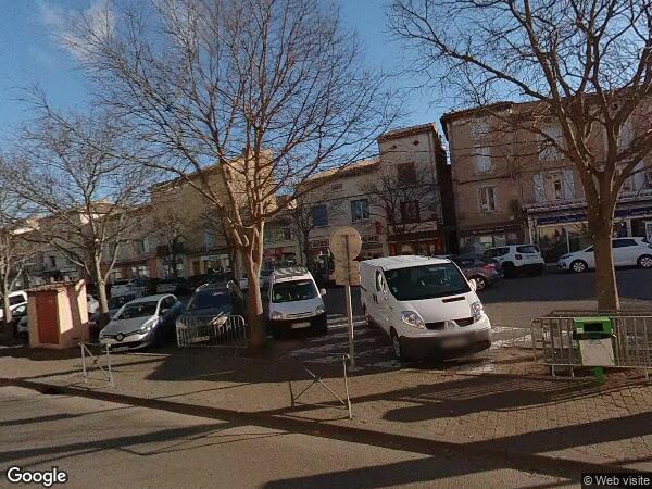 UN IMMEUBLE À USAGE COMMERCIAL ET D'HABITATION