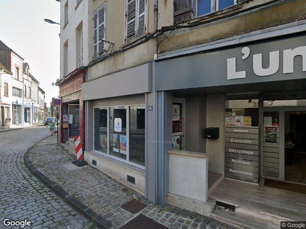 UN IMMEUBLE À USAGE DE COMMERCE ET HABITATION