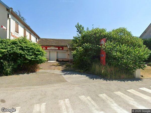 UNE MAISON À USAGE D'HABITATION ET DE COMMERCE